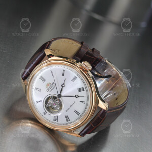 Orient automatic watch in rose gold with open balance...
