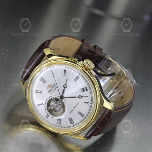Orient automatic watch in gold with open balance wheel...